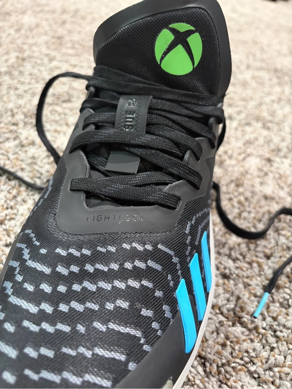 adidas Men's D.O.N Issue #4 Black Sneaker with Bright Blue Three Stripes
